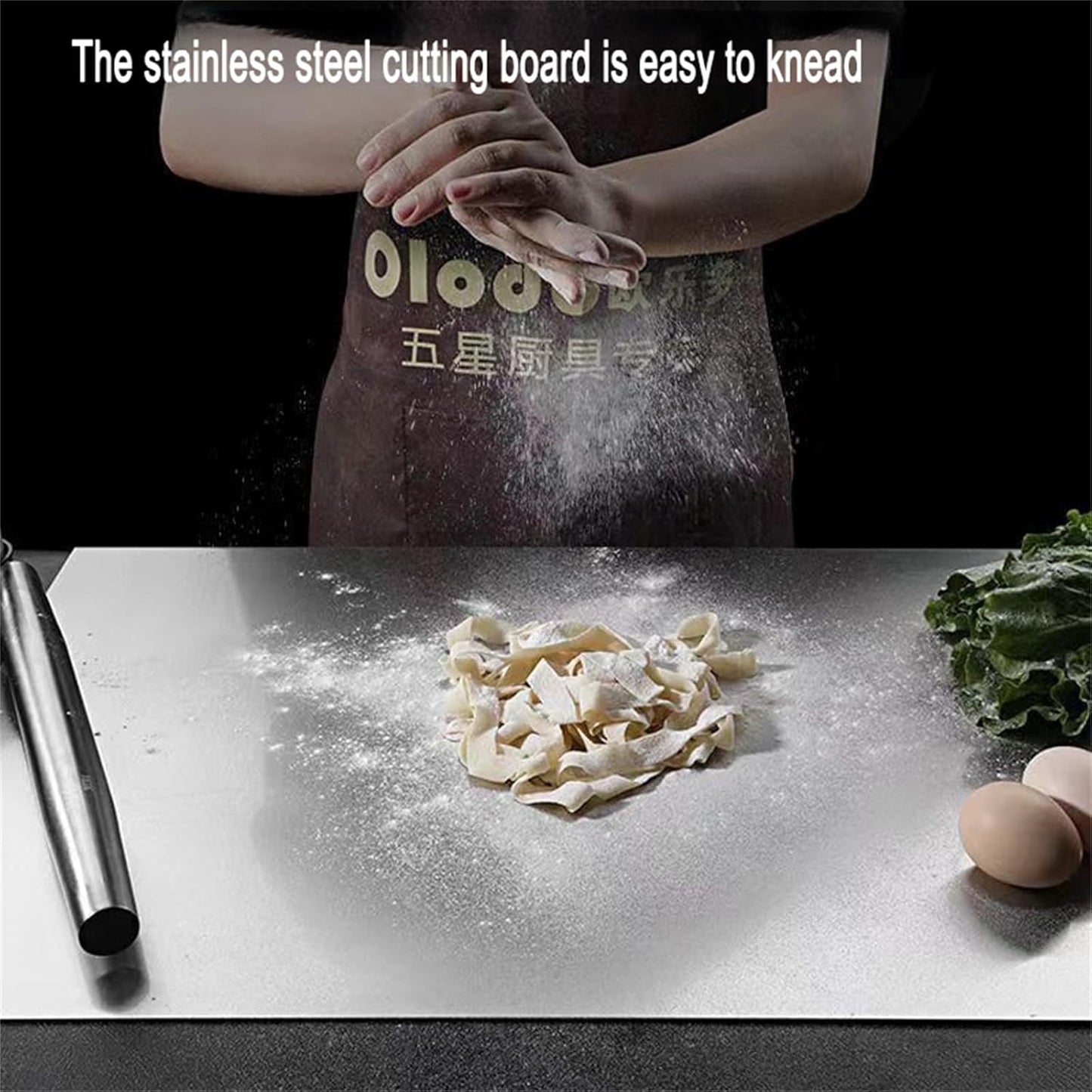 Person kneading dough on a stainless steel chopping board with text overlay